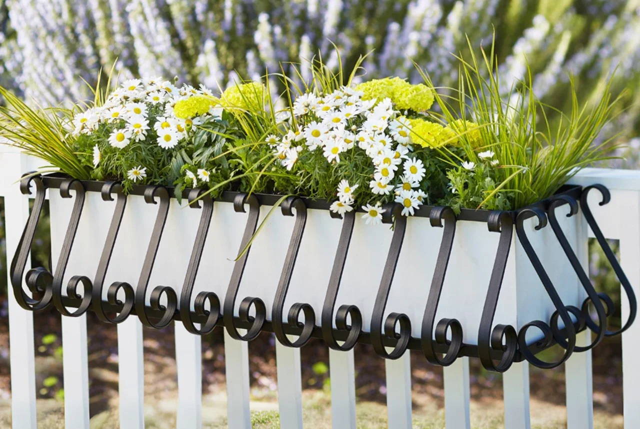 European Railing Planter with white liner on a railing with lavender in background