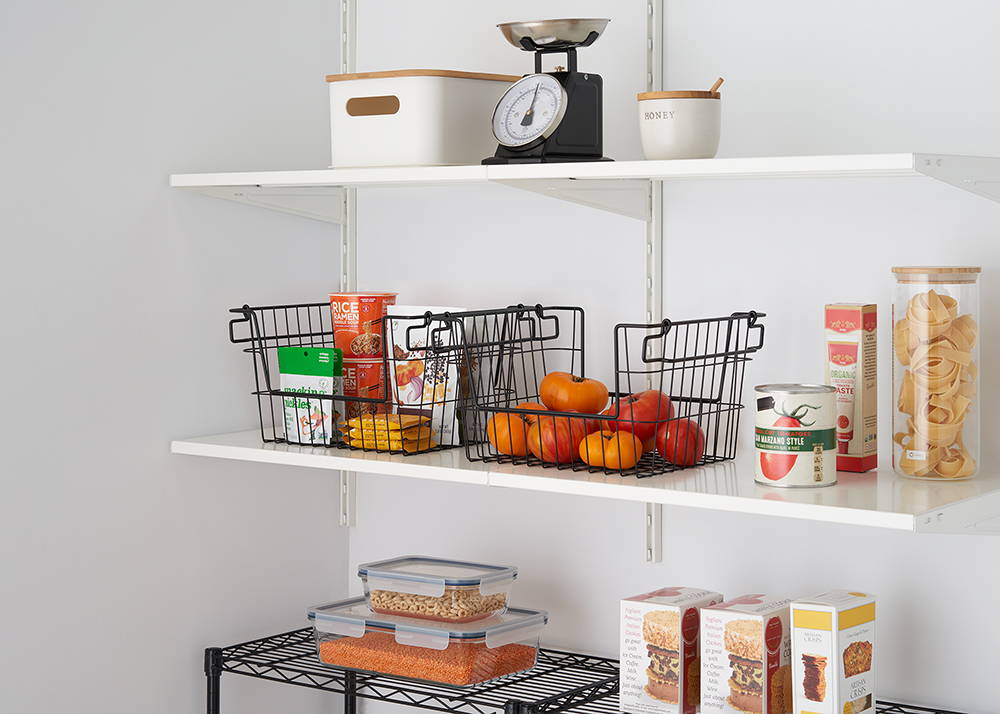 Stackable wire baskets on a shelf in the pantry 