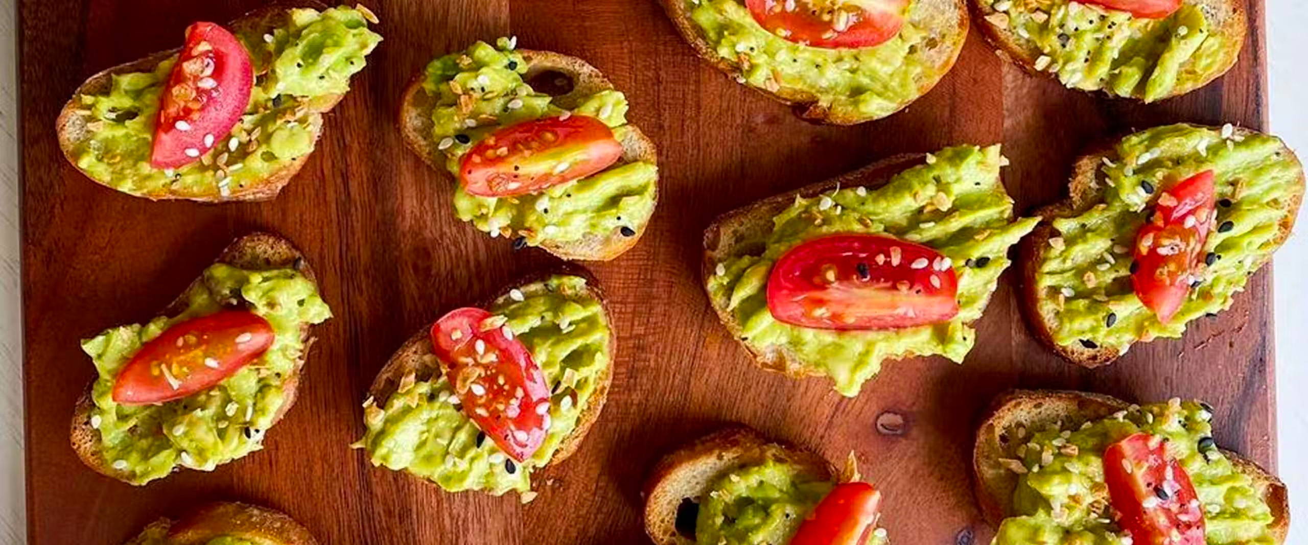 overhead picture of Brunch Crostini with Avocado  on a serving board.