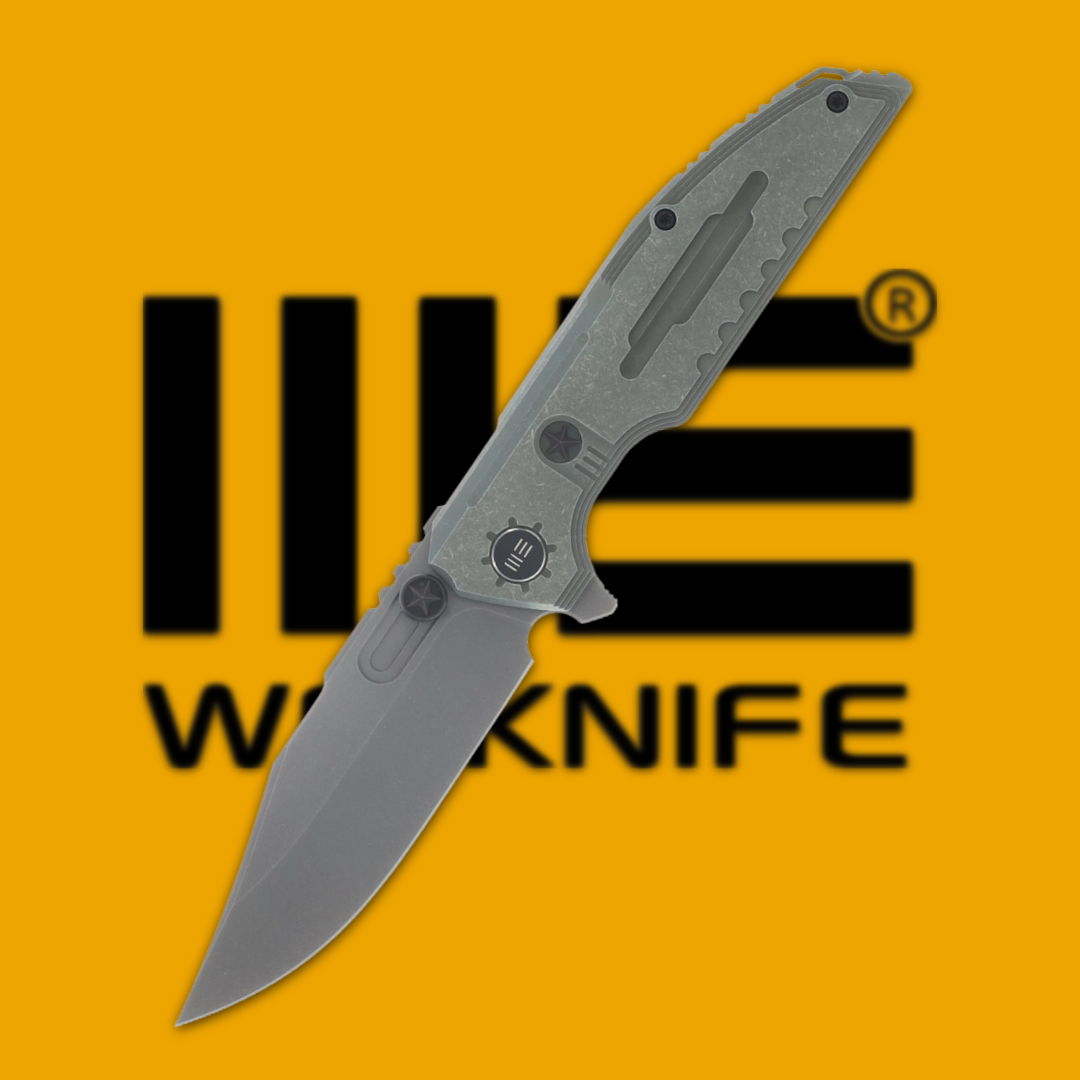 Folding knife with a stainless steel blade on an orange background.