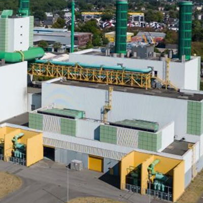 Aerial view of an industrial facility with green and yellow structures.