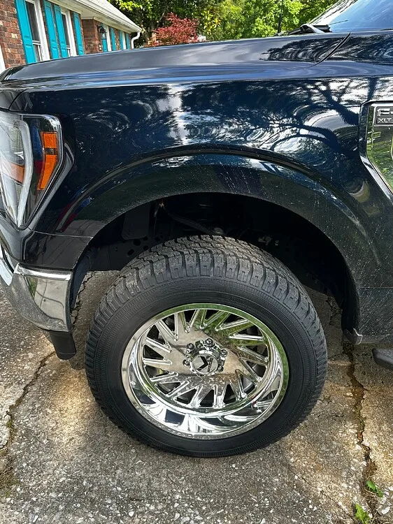 Close-up of Ford F150 front wheel and fender
