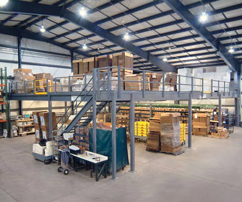 Cogan mezzanine used for general storage in busy warehouse.