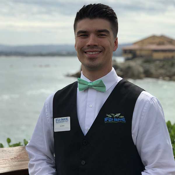 Waiter wearing a bow tie and vest