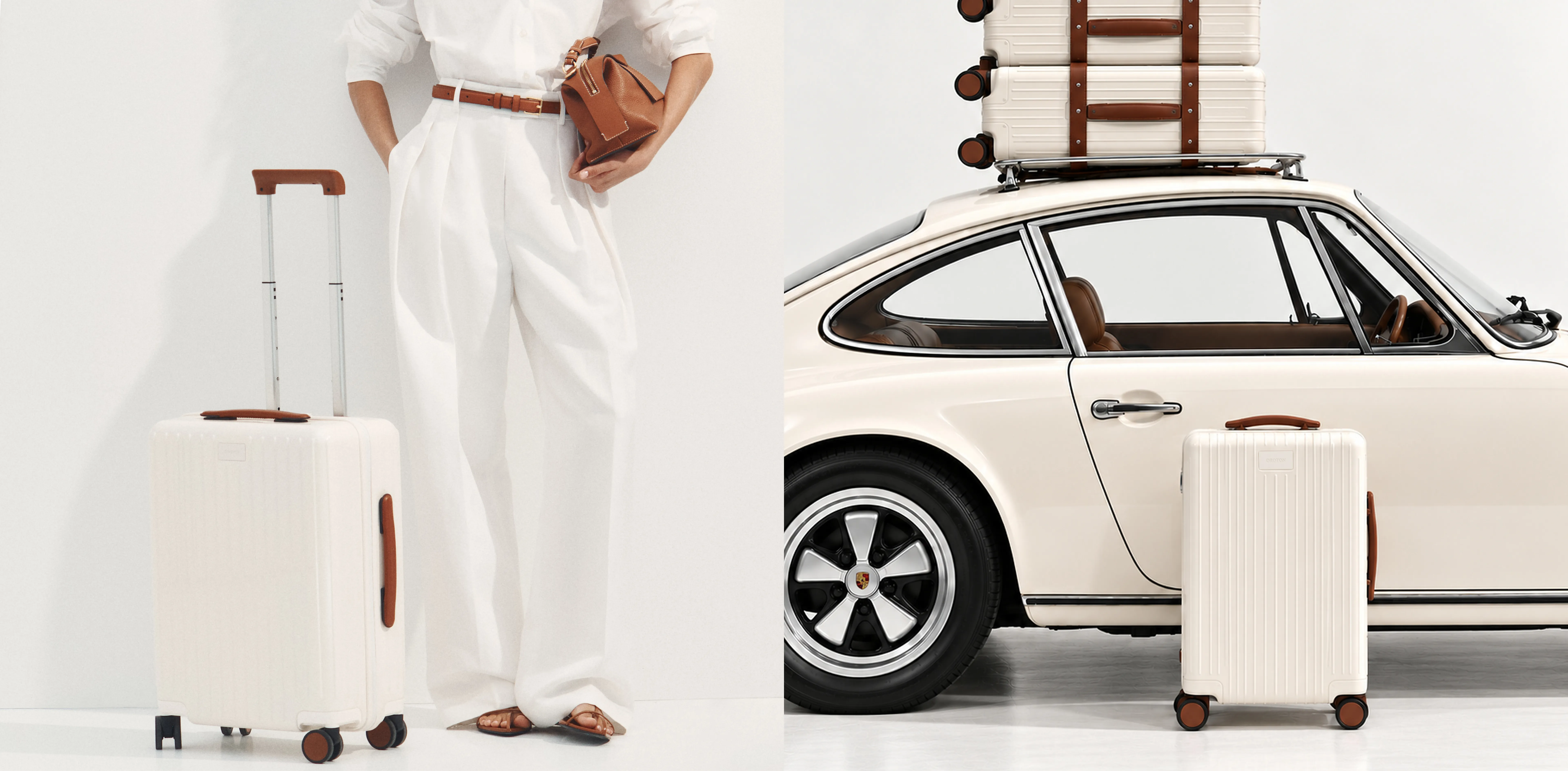Person in white outfit with luggage beside a vintage car.