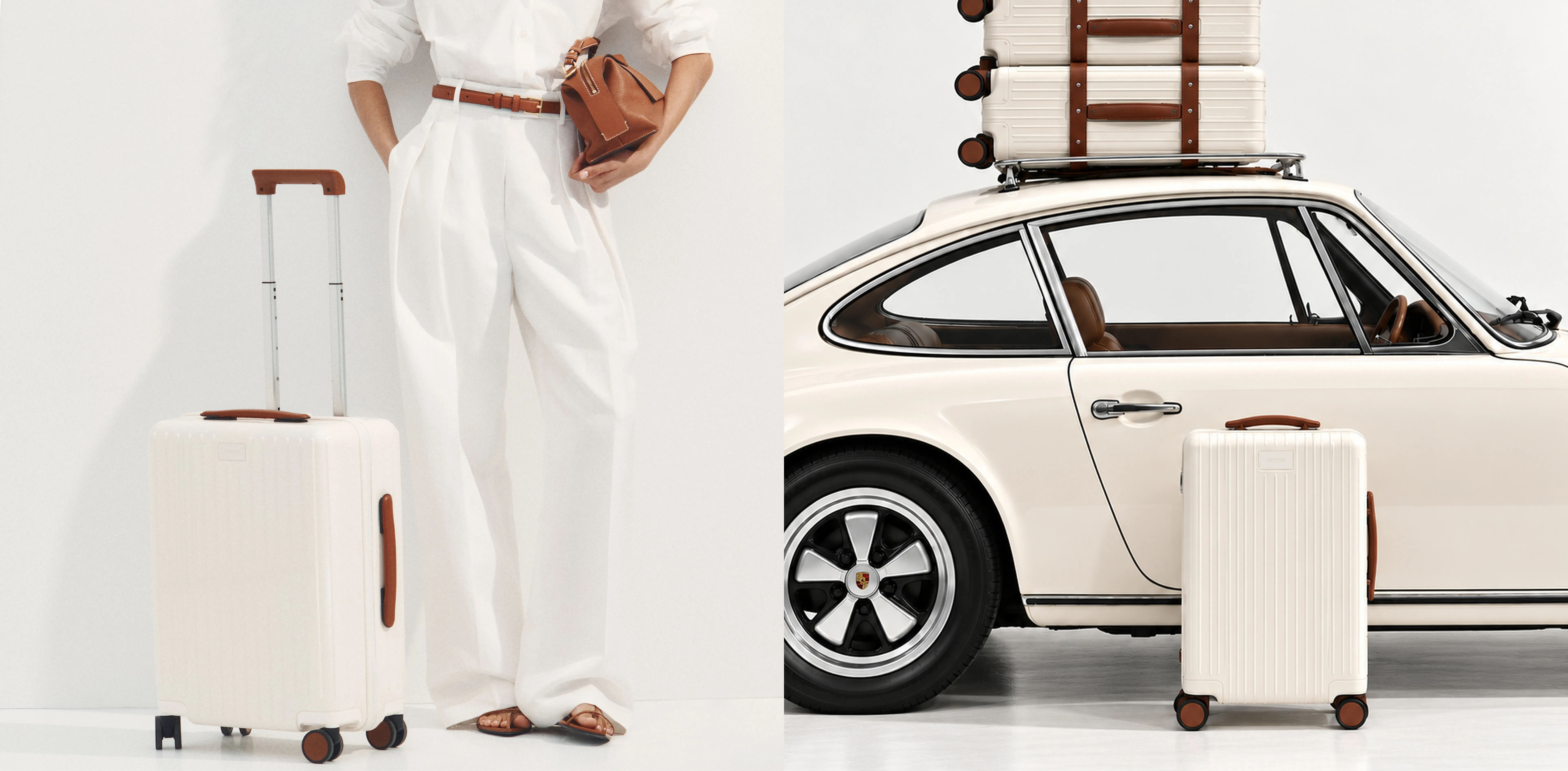 Person in white outfit with luggage beside a vintage car.