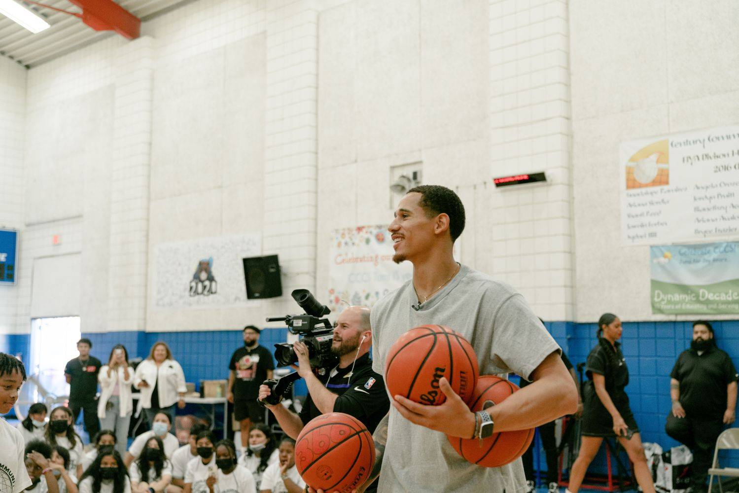 juan toscano getting ready to give out basketball