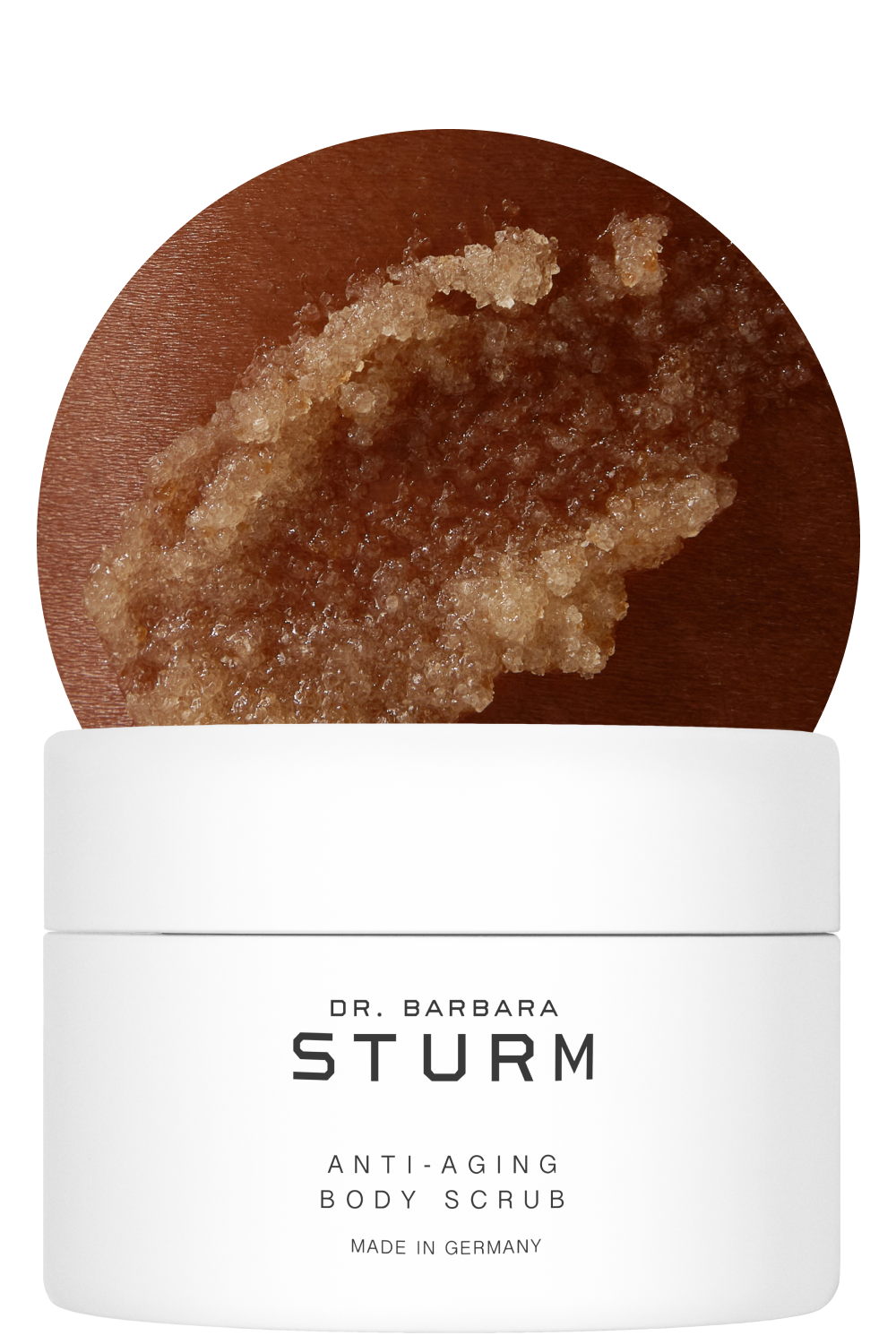 Dr. Barbara Sturm anti-aging body scrub in a white container with brown scrub texture.