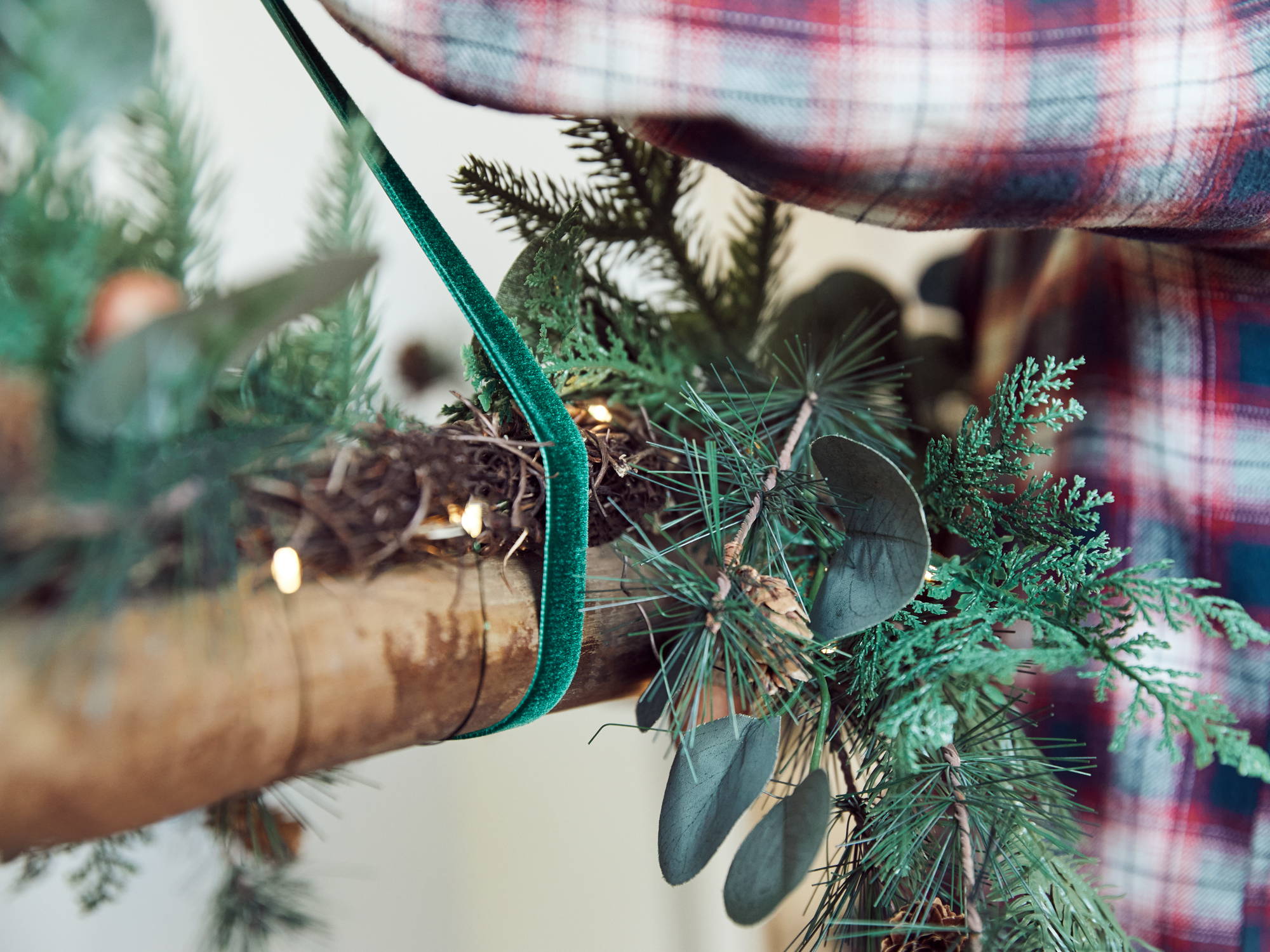 Christmas ladder decoration with micro lights and green velvet ribbon.