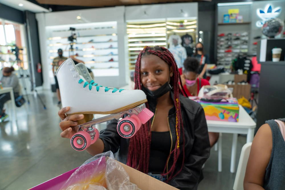 girl holding roller skate at for her event
