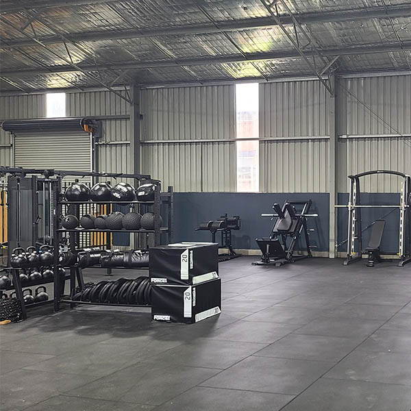 High School Gym Fit Out featuring durable commercial rubber flooring, providing a safe and shock-absorbent surface for all types of workouts.