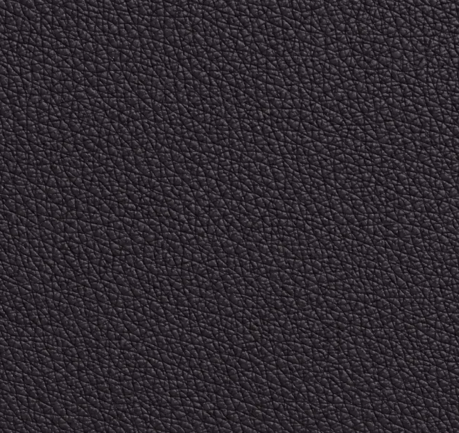 Textured dark surface resembling leather or synthetic material.