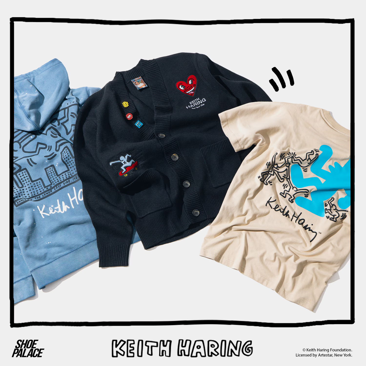 Various clothing items featuring Keith Haring designs on display.