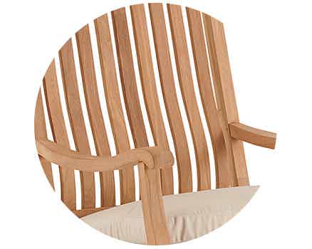 Wooden chair backrest with slats and armrest detail.