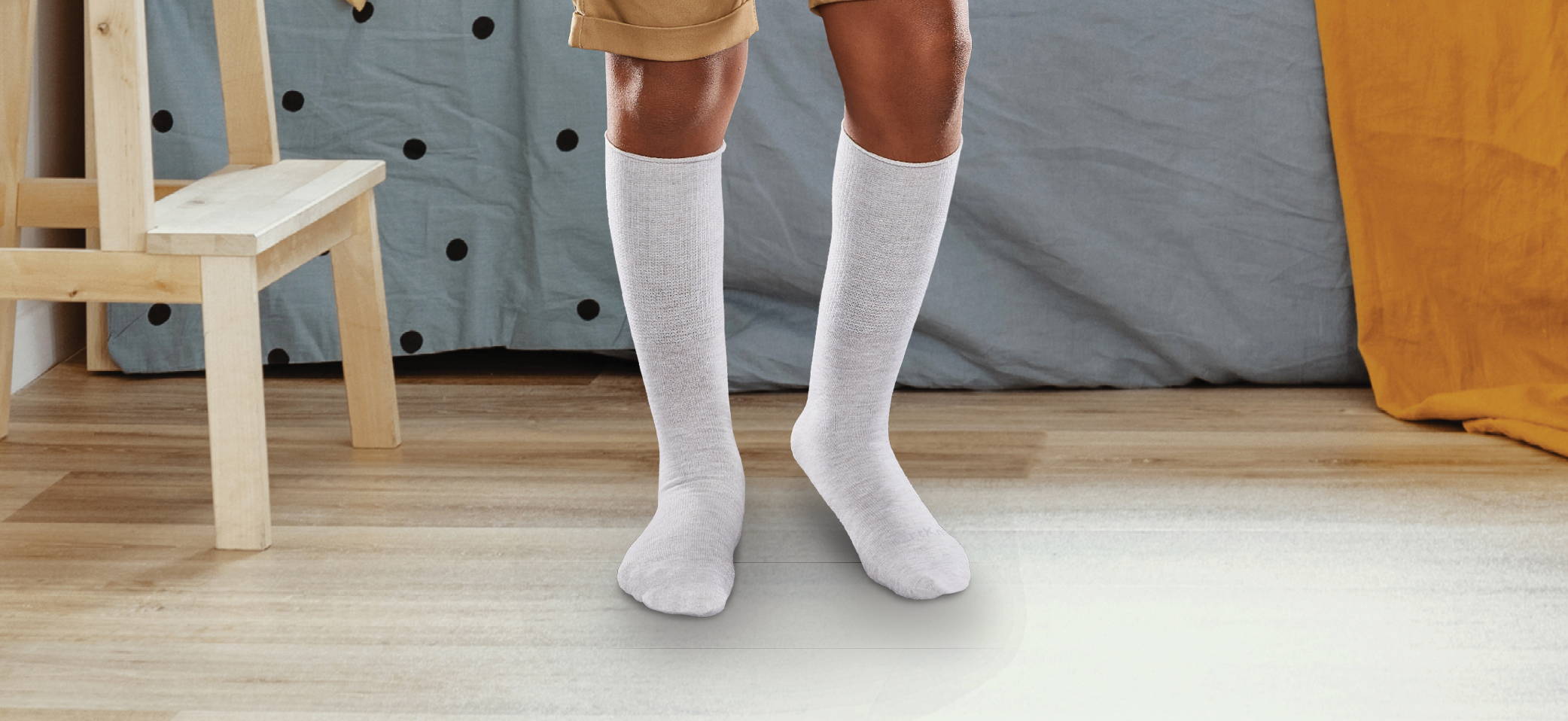 boy wearing grey seamless SmartKnitKIDS socks