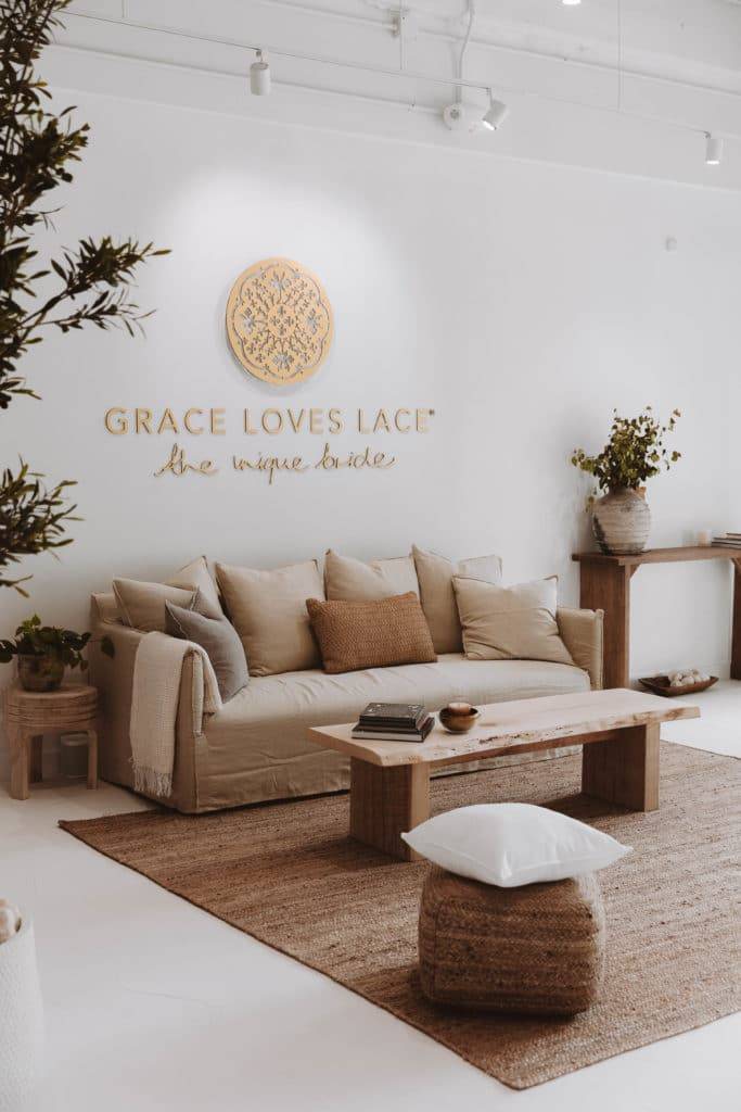 Grace Loves Lace Washington Bridal boutique with beige coloured couch and interiors
