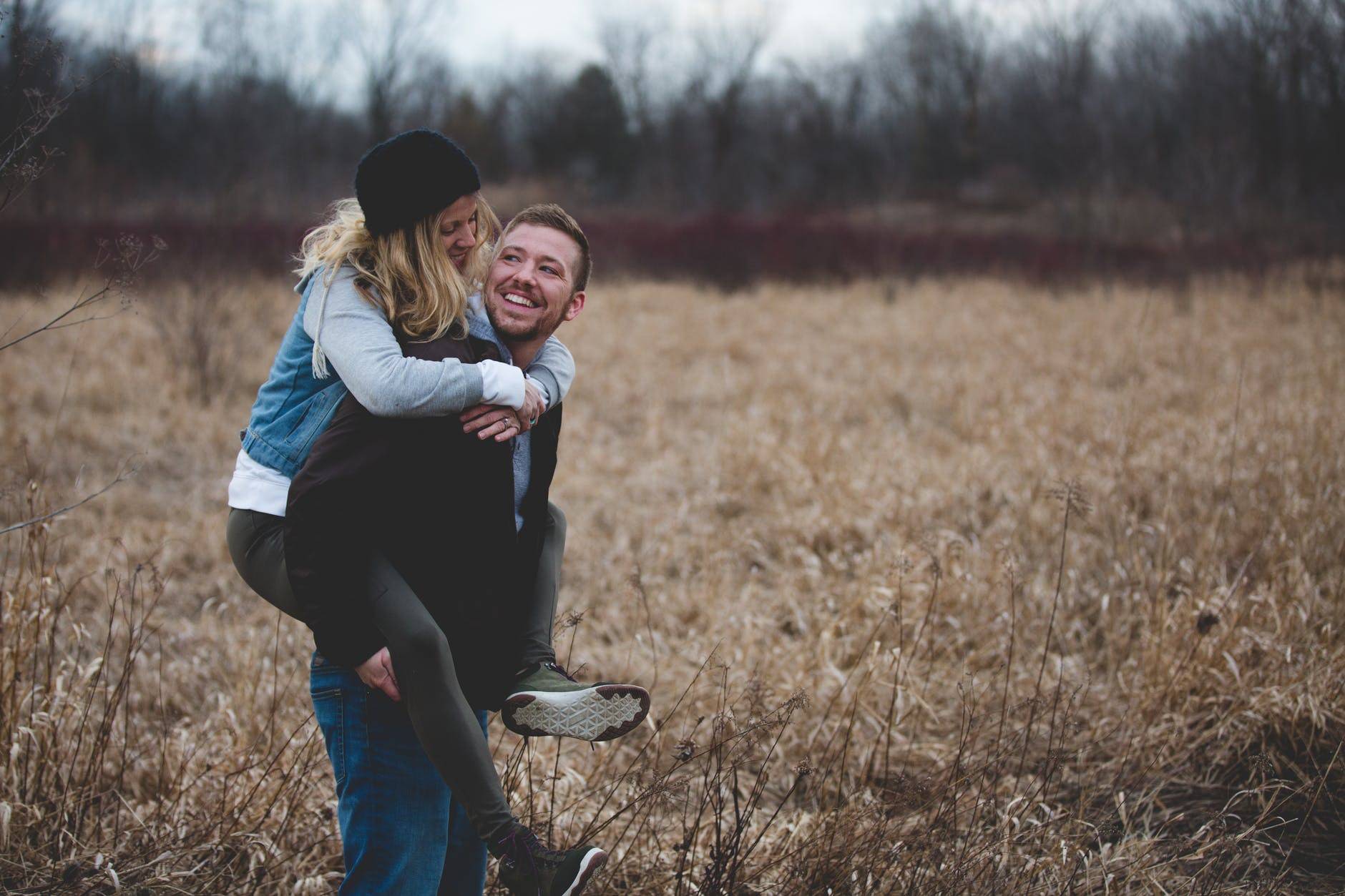 Photo Of Man Carrying His Partner