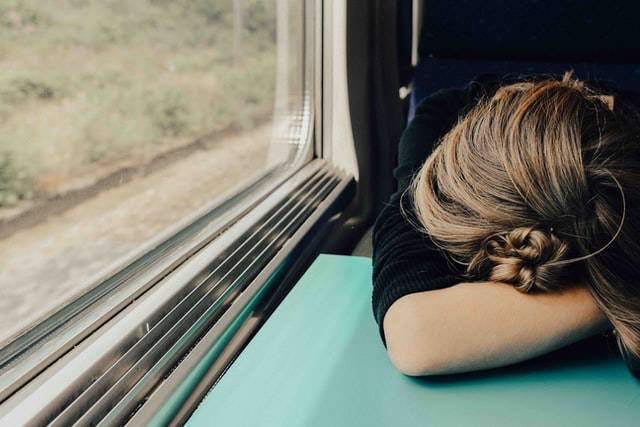 Person Sleeping On A Train