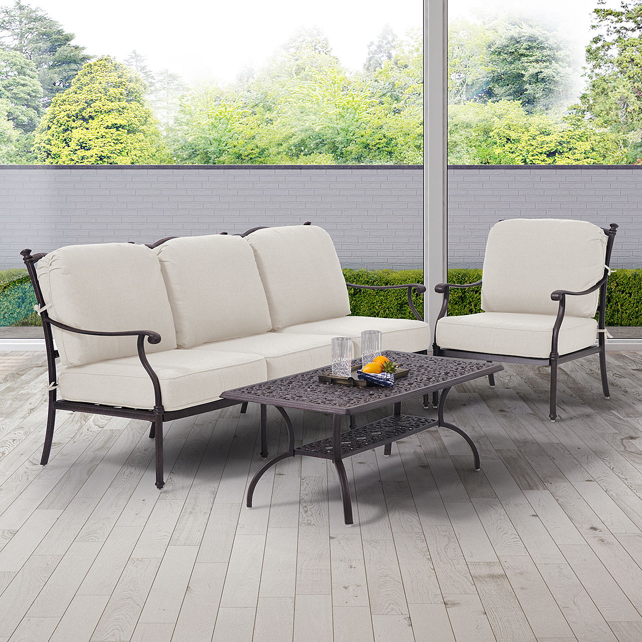 Outdoor seating set with white cushions and a coffee table.