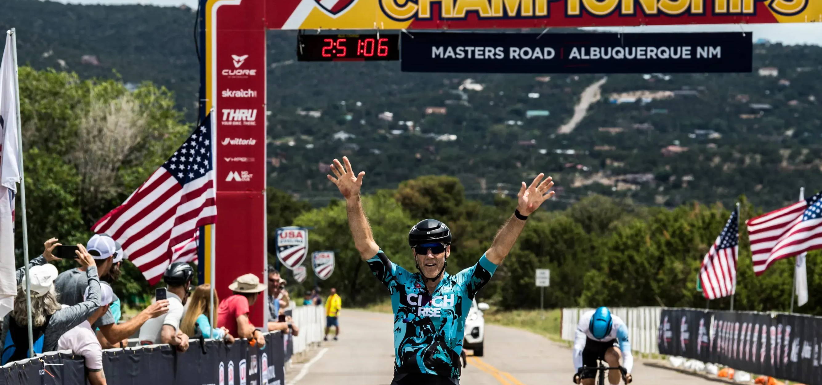 Matt Tanner holds his hands over his head as he wins the masters road national championships in albuquerque new mexico