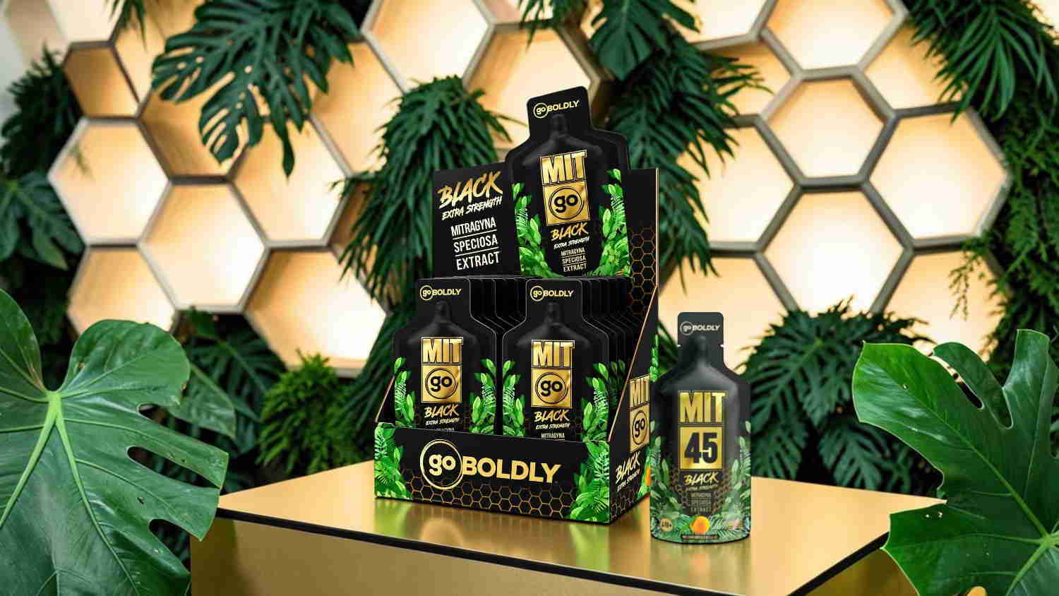Display of various bottles with green plants and a honeycomb background.