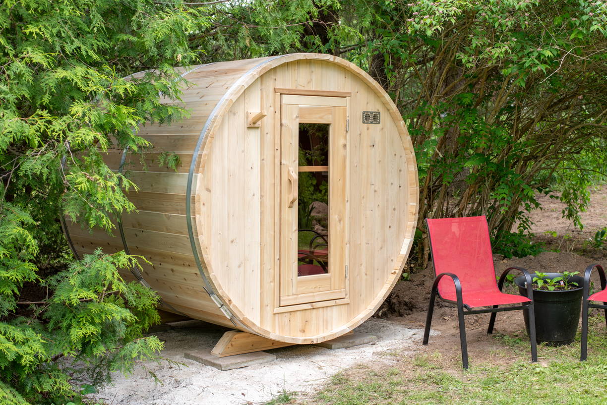 Compact Barrel sauna in natural backyard setting
