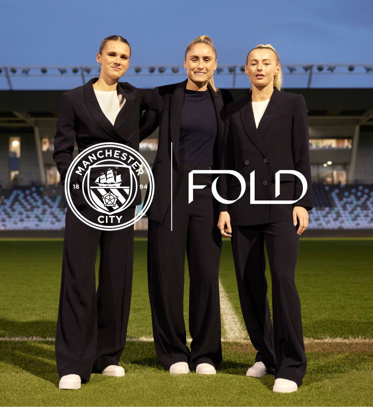 Man City players wearing Clever Crepe suiting from The Fold London