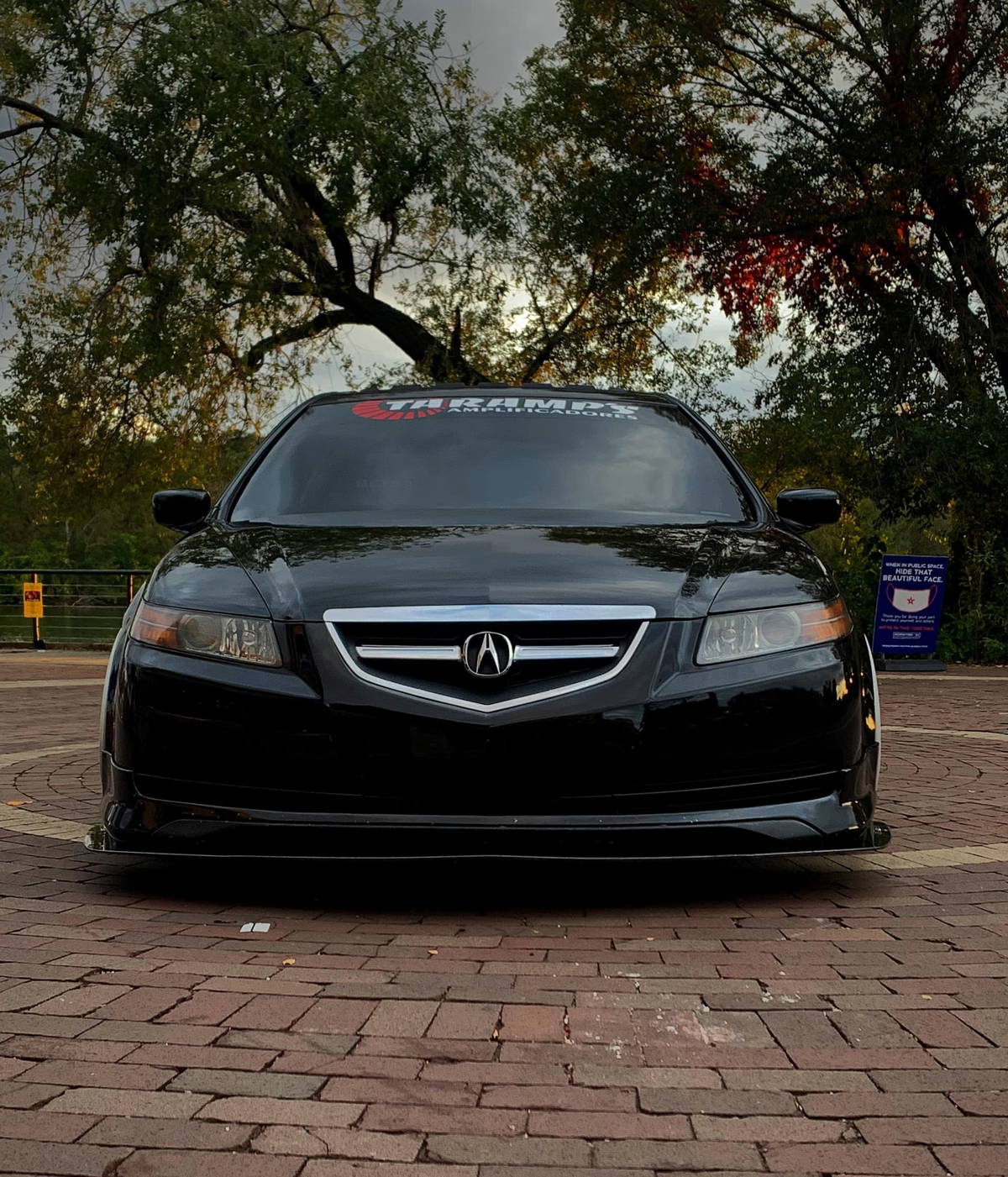 Front-facing low-angle view of Adonis's black 2005 Acura TL with HornBlasters Conductor's Special 127H train horn kit featured customer install gallery photo 1
