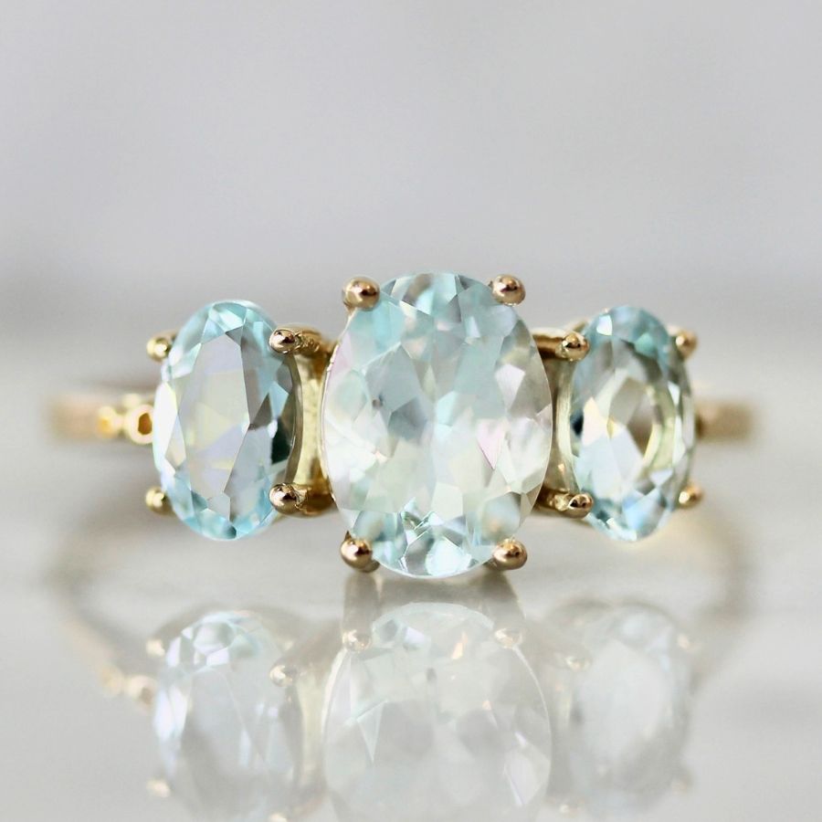 Oval cut three stone aquamarine ring