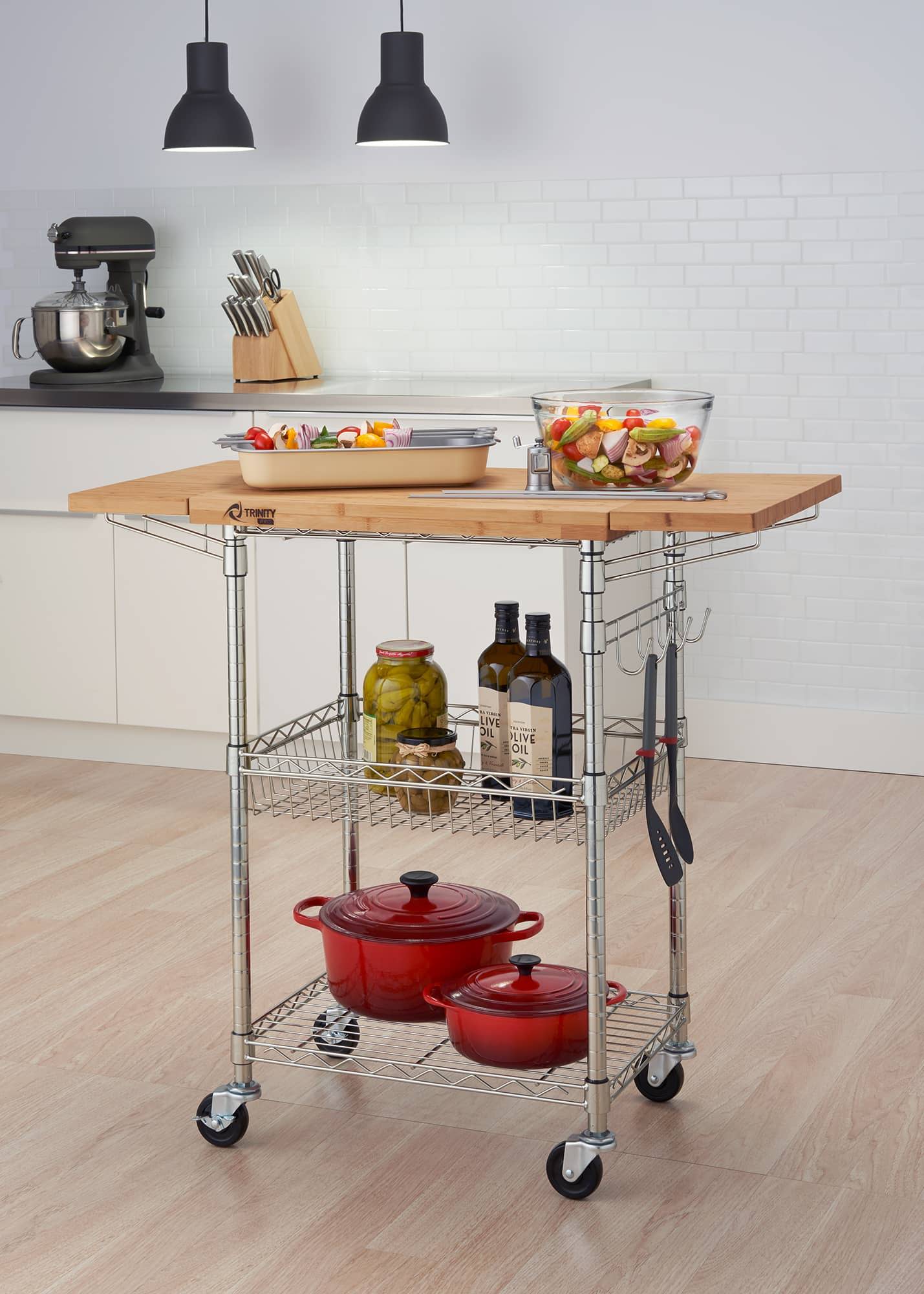 chrome kitchen cart in the middle of the room