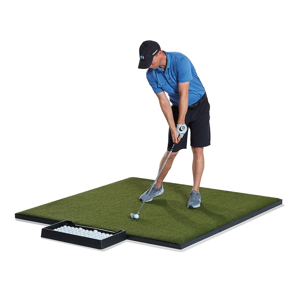 Man getting ready to swing on a Fiberbuilt tee box mat