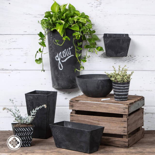 White chalk art on black Artstone pots & planters