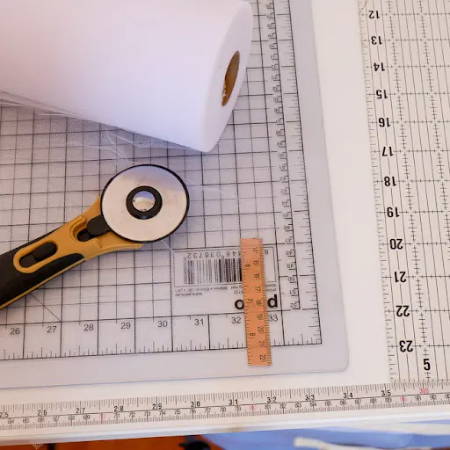 Tools to cut tulle fabric: rotary cutter, mat, quilt ruler