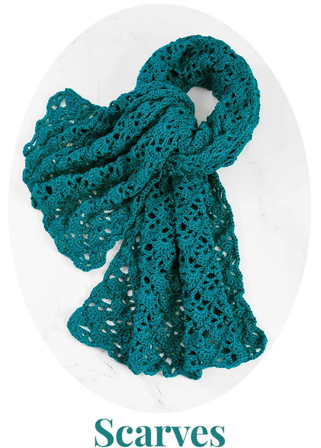 Teal crocheted scarf displayed on a light background.
