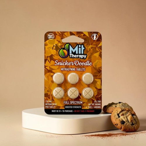 Mit Therapy Snicker Doodle edible packaging with cookies on a surface.