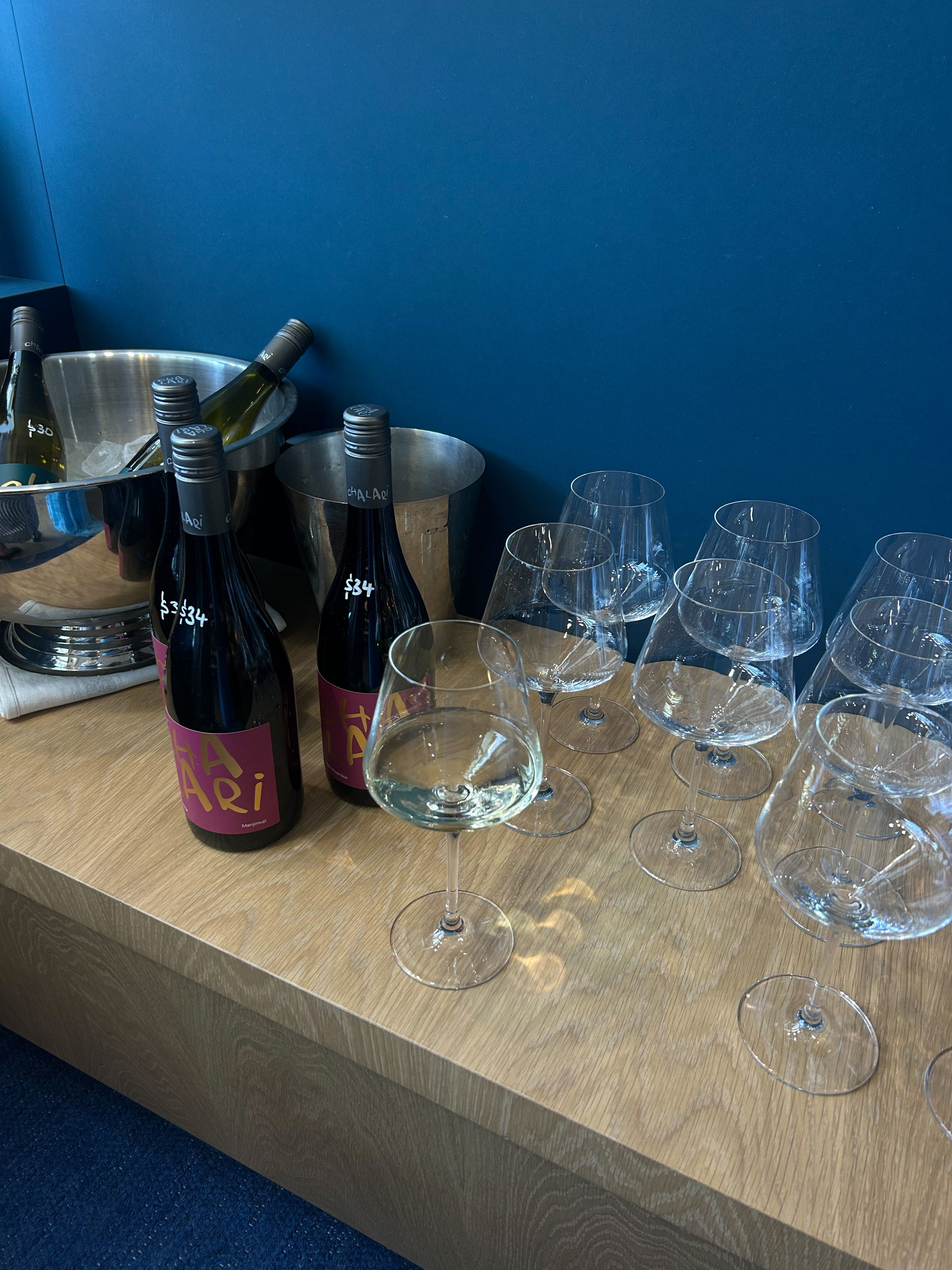 Bottles of wine and glasses at Winona Wine in Avalon.