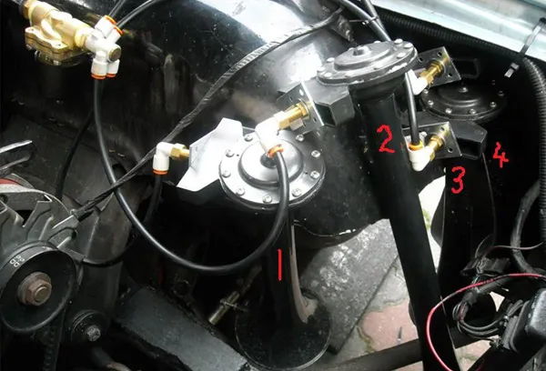 Close-up of the numbered horn arrangement and air line routing on Adam's 1964 Chevrolet Impala, install photo 4