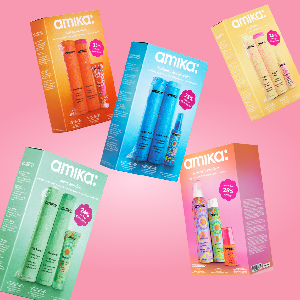 Colorful hair care product boxes on a pink background.