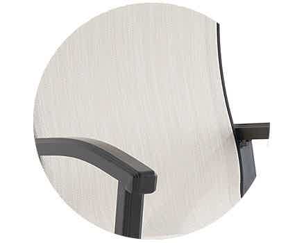 Close-up of a modern chair's armrest and seat design.