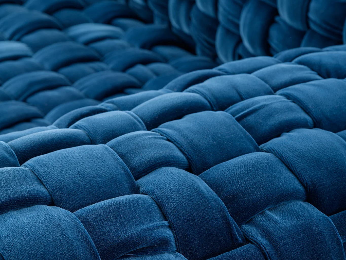 Close-up of woven blue fabric texture.