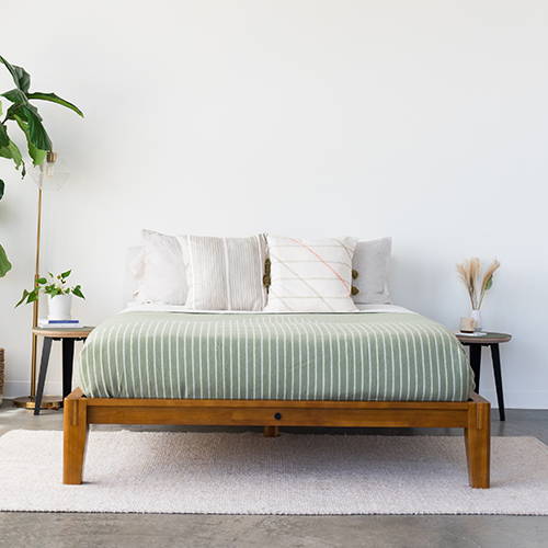 Sage SoftWool Blanket on bed