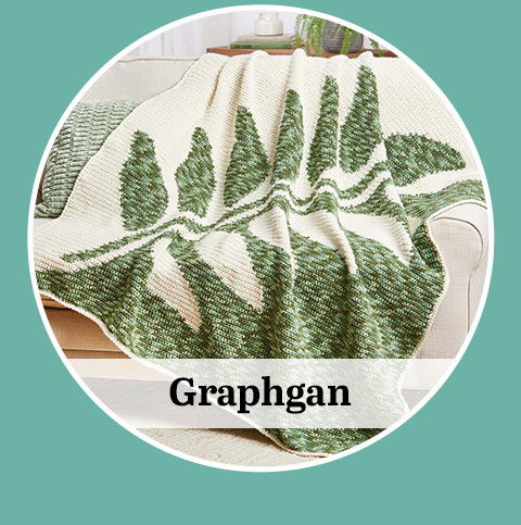 A green leaf-patterned blanket labeled 