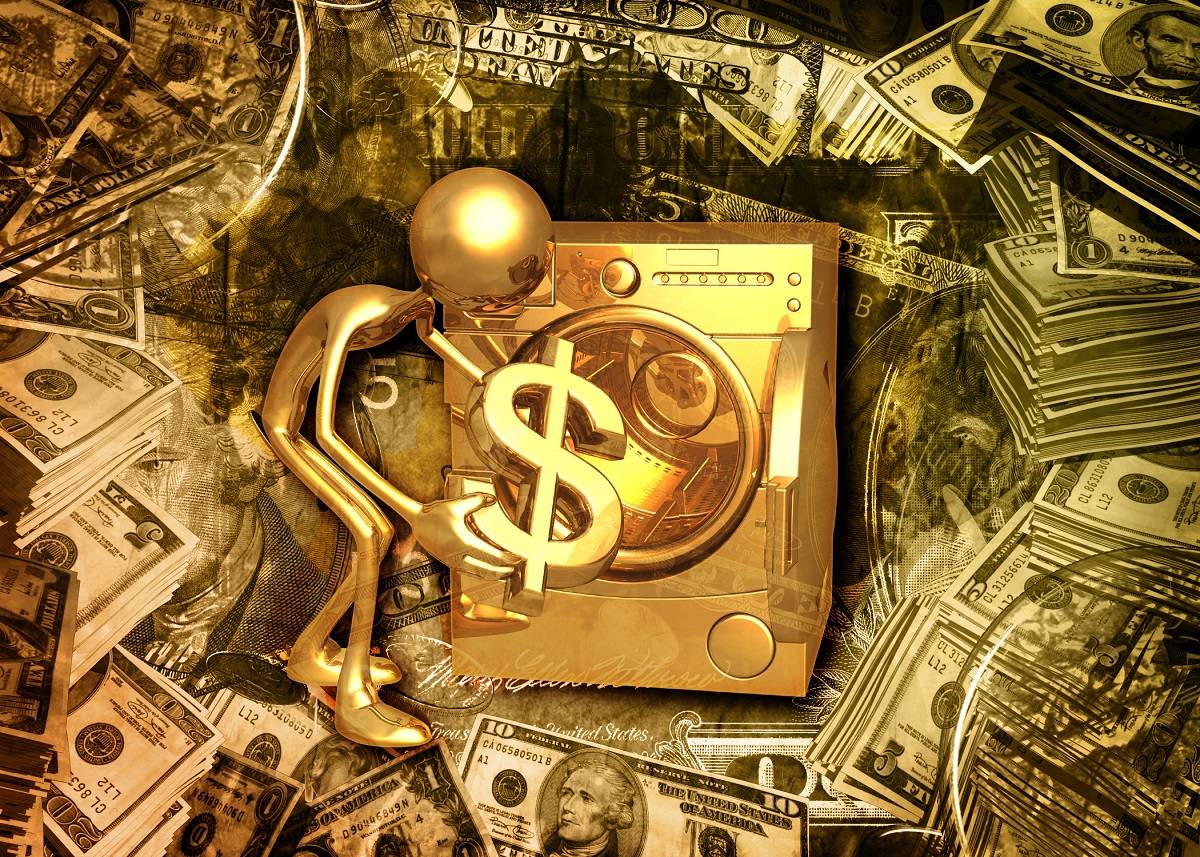 Gold figure placing a dollar sign into a gold laundry machine