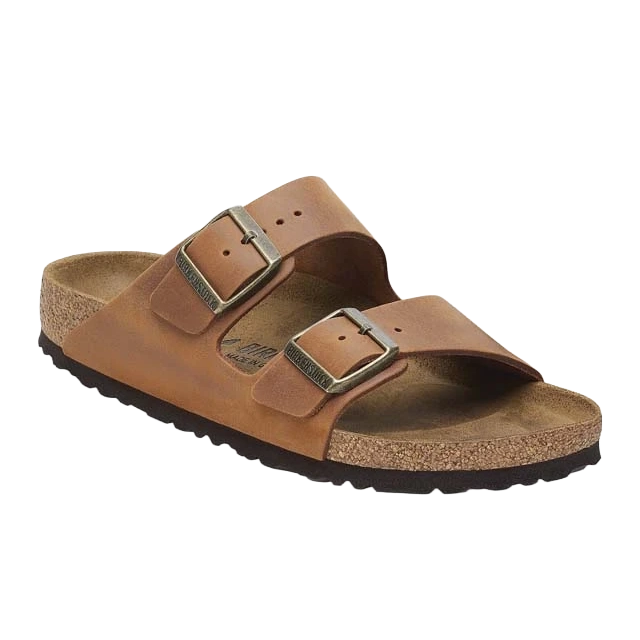 Brown leather sandals with two adjustable buckles and cork footbed.