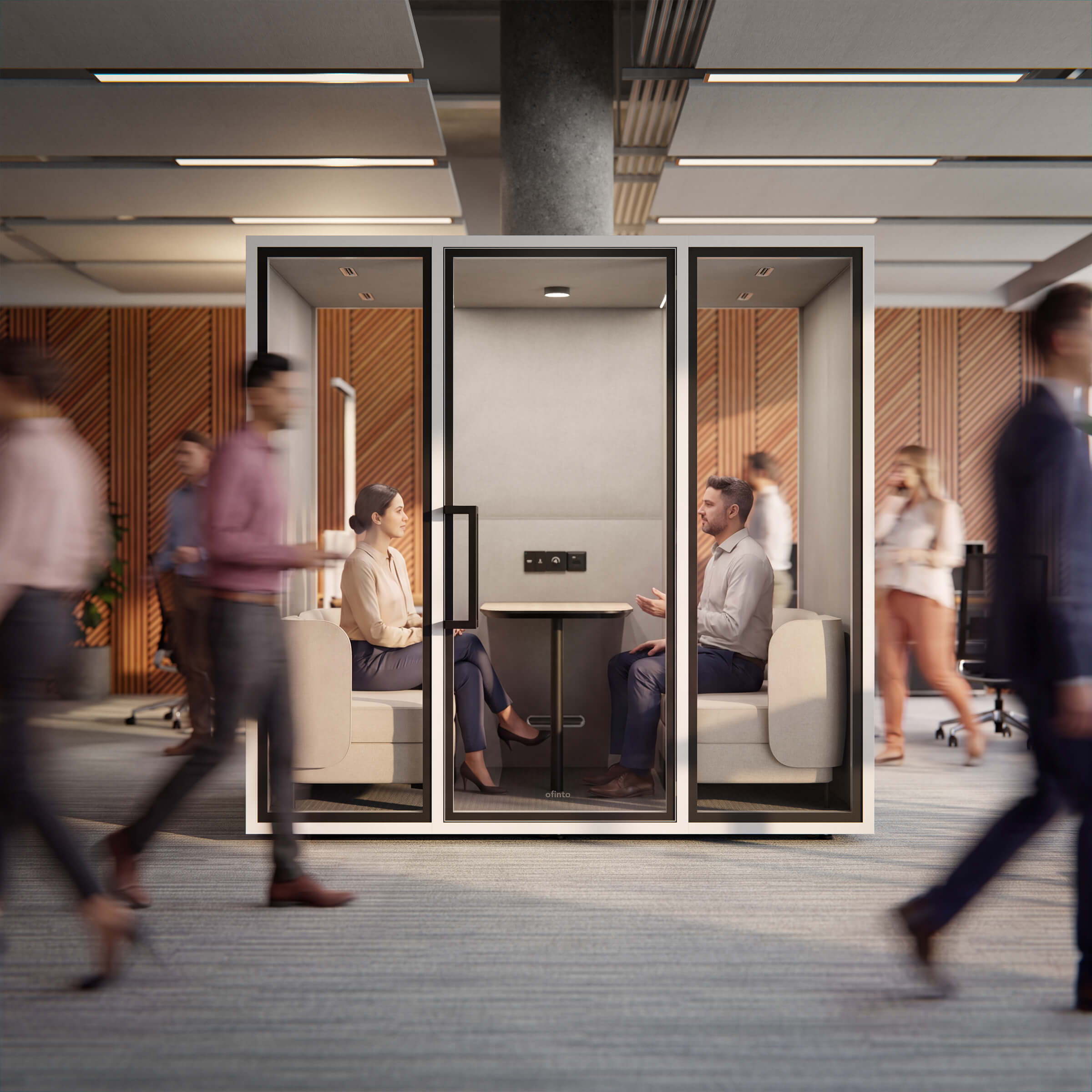 A man and a woman discuss important details during an ofinto Focus Meet in a noisy open-plan office