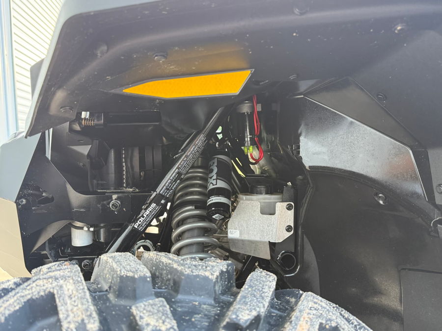 Close-up of Compact Electric horn mounted in front wheel well of 2025 Polaris Xpedition XP5 HornBlasters gallery photo 3