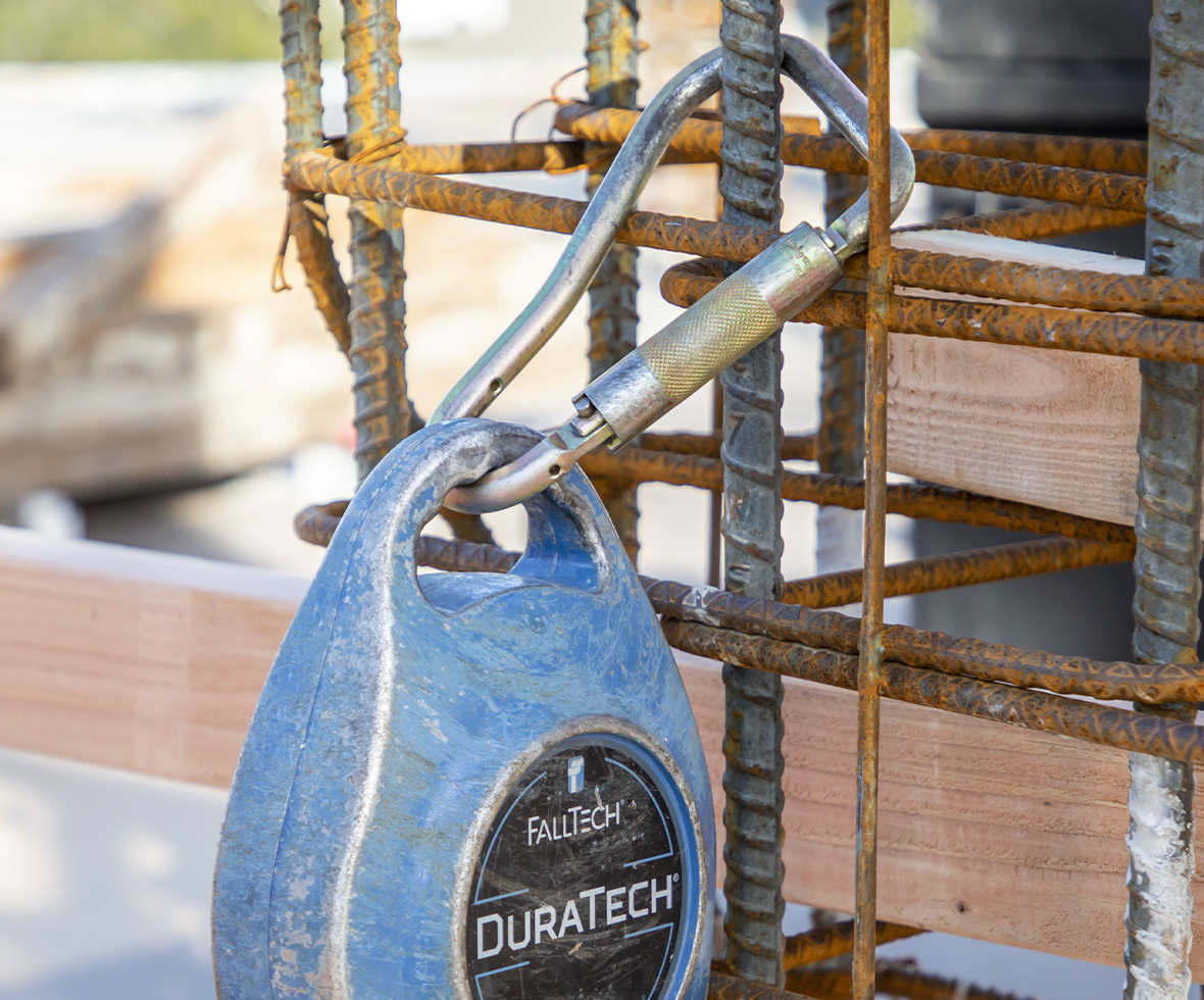 Carabiner connecting the DuraTech self-retracting lifeline to rebar