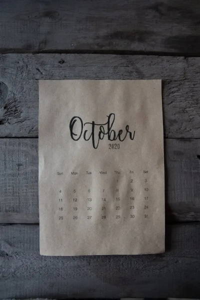 Image of sheet of paper with a calendar of October on it. 