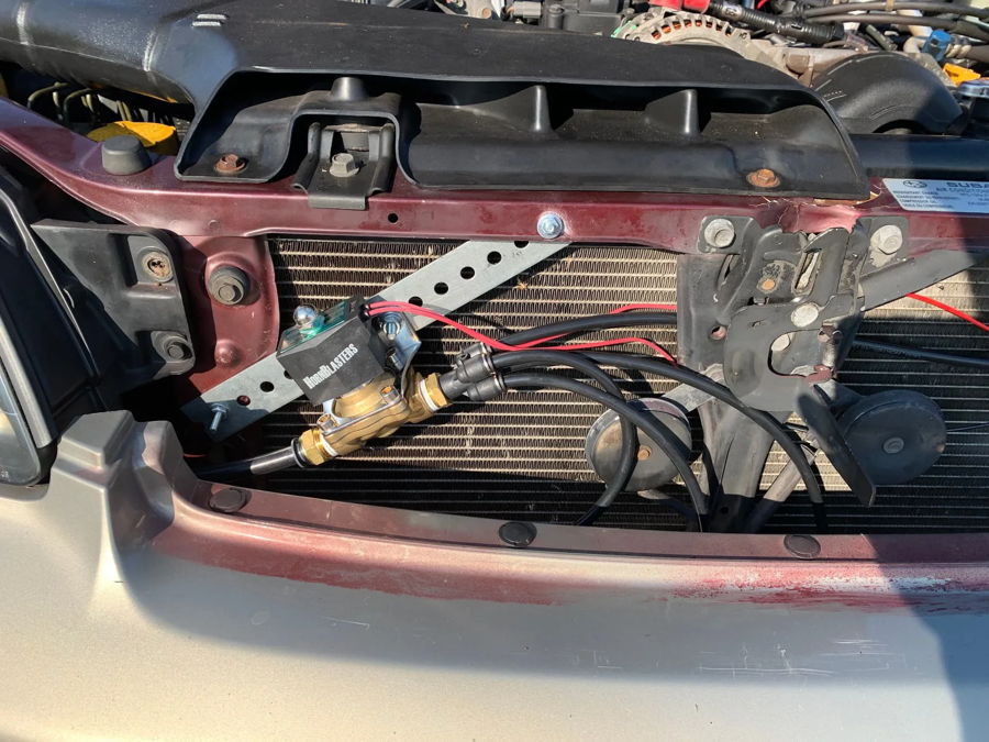 Low-angle black air horns mounted under front bumper Virginia license plate silver Subaru Outback Adam's Conductor's Special 228H gallery photo 3