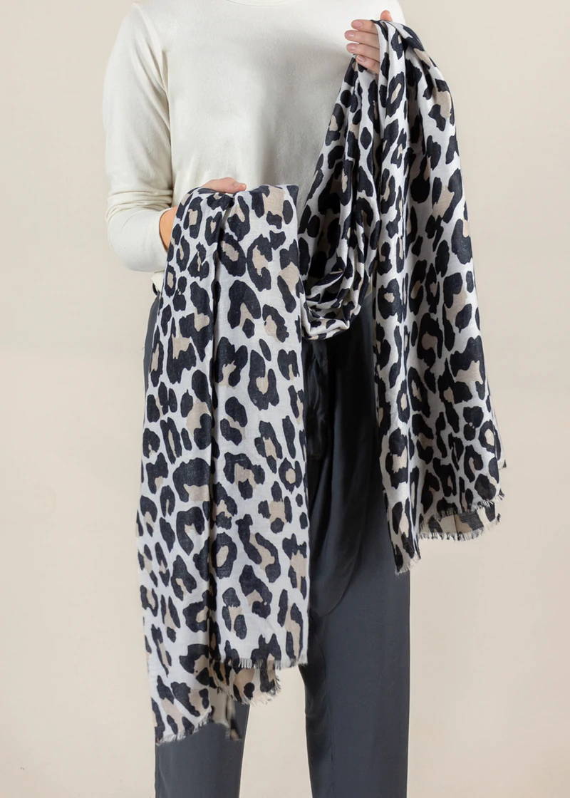 A pale leopard print scarf